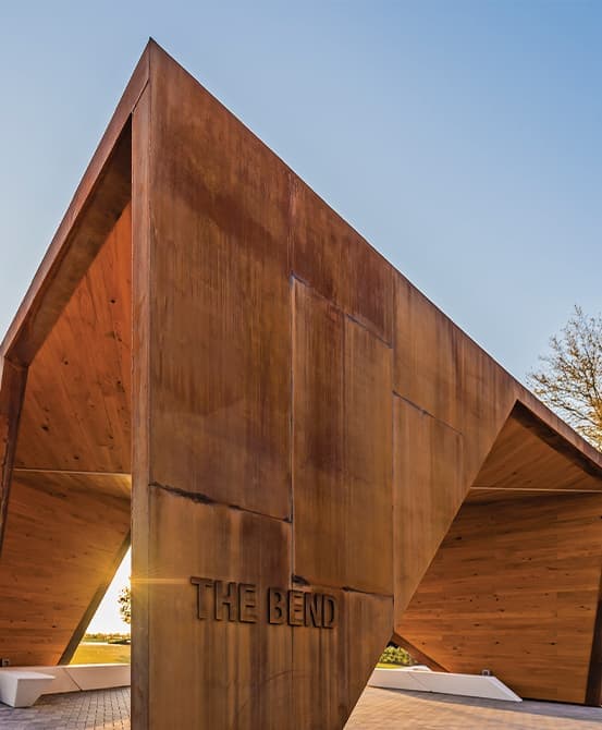 Frisco Station amenity identity signage on artful corten pavilion.